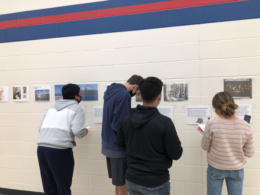 Students learning in hallway